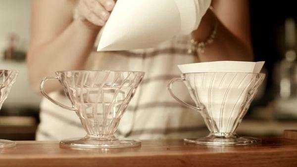 Filters Stock Videos Dissolve Coffee Filters Being Added To Filter Holders In A Royalty Free Stock Video