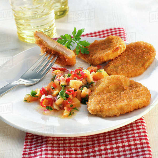 Breaded chicken escalopes with vegetables Stock Photo Dissolve