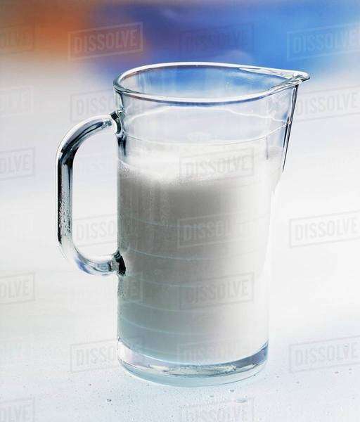 Milk in glass jug Stock Photo Dissolve