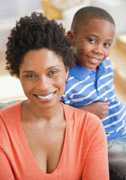 Smiling Black mother and son - Stock Photo - Dissolve