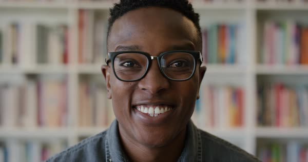 Portrait happy young black man student smiling enjoying successful