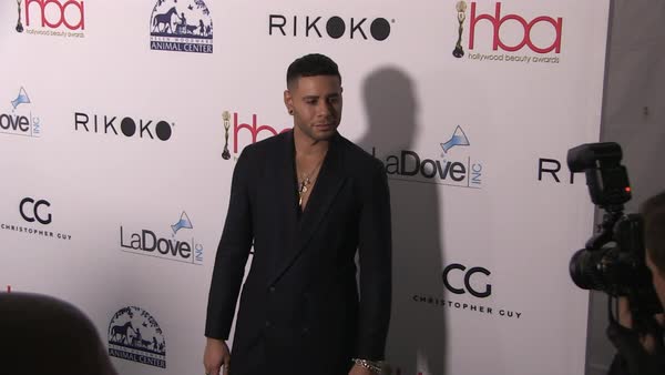 Hair Stylist Cesar Ramirez Poses On The Red Carpet Before