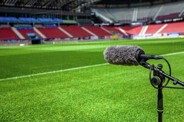 Directional microphone on a football field to record the sound of a