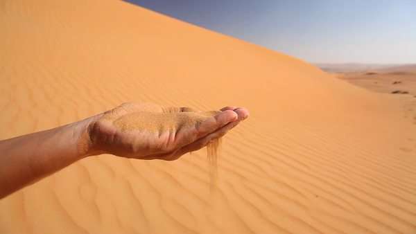Single Hand Holding Sand In Desert Sand Running Through Fingers View From Top Stock Video Footage Dissolve