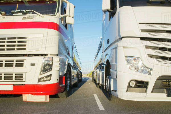 Commercial trucks side by side on the road Royalty free Stock Photo