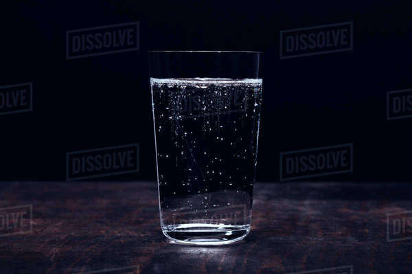 Close up sparkling water in glass - Stock Photo - Dissolve