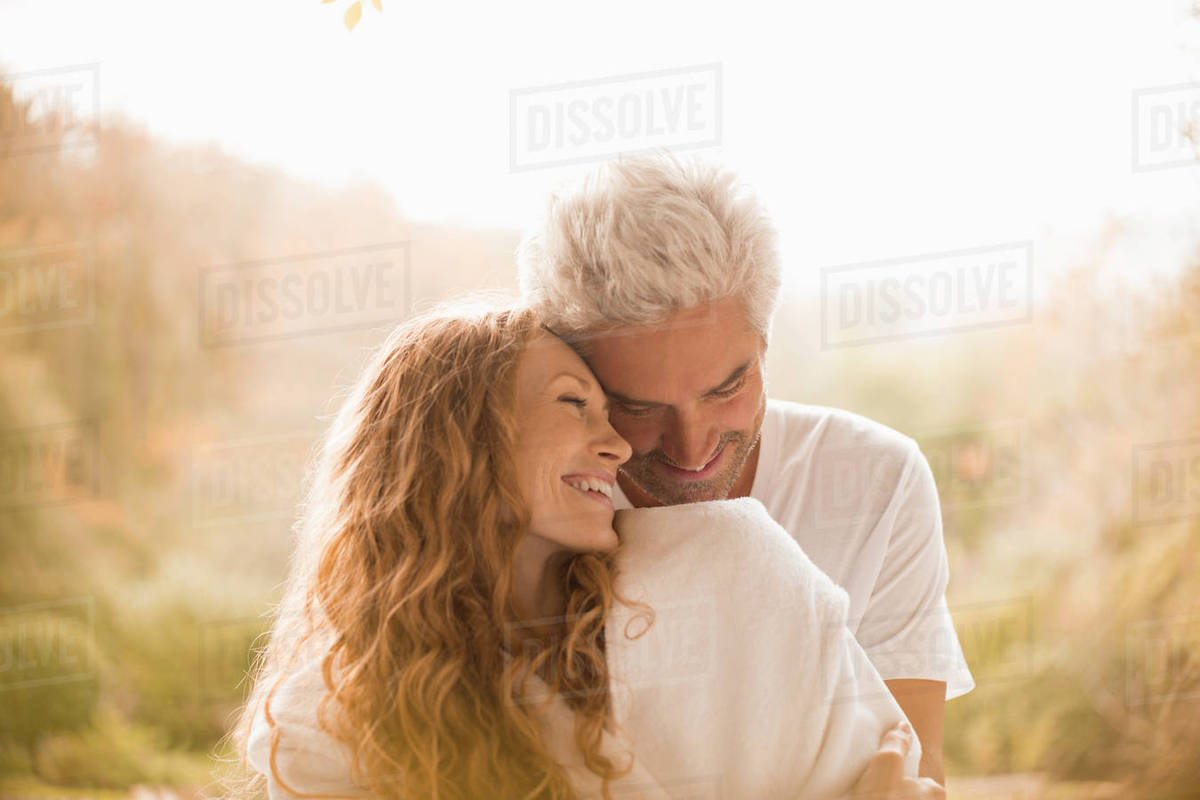 Affectionate couple hugging and smiling - Royalty-free Stock Photo ...
