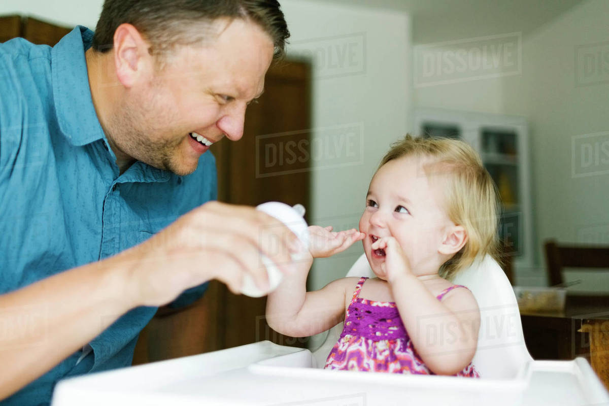 Father feeding baby girl  Royalty-free stock photo