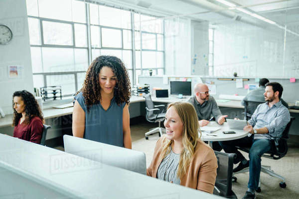 Women using computer in office - Royalty-free Stock Photo | Dissolve