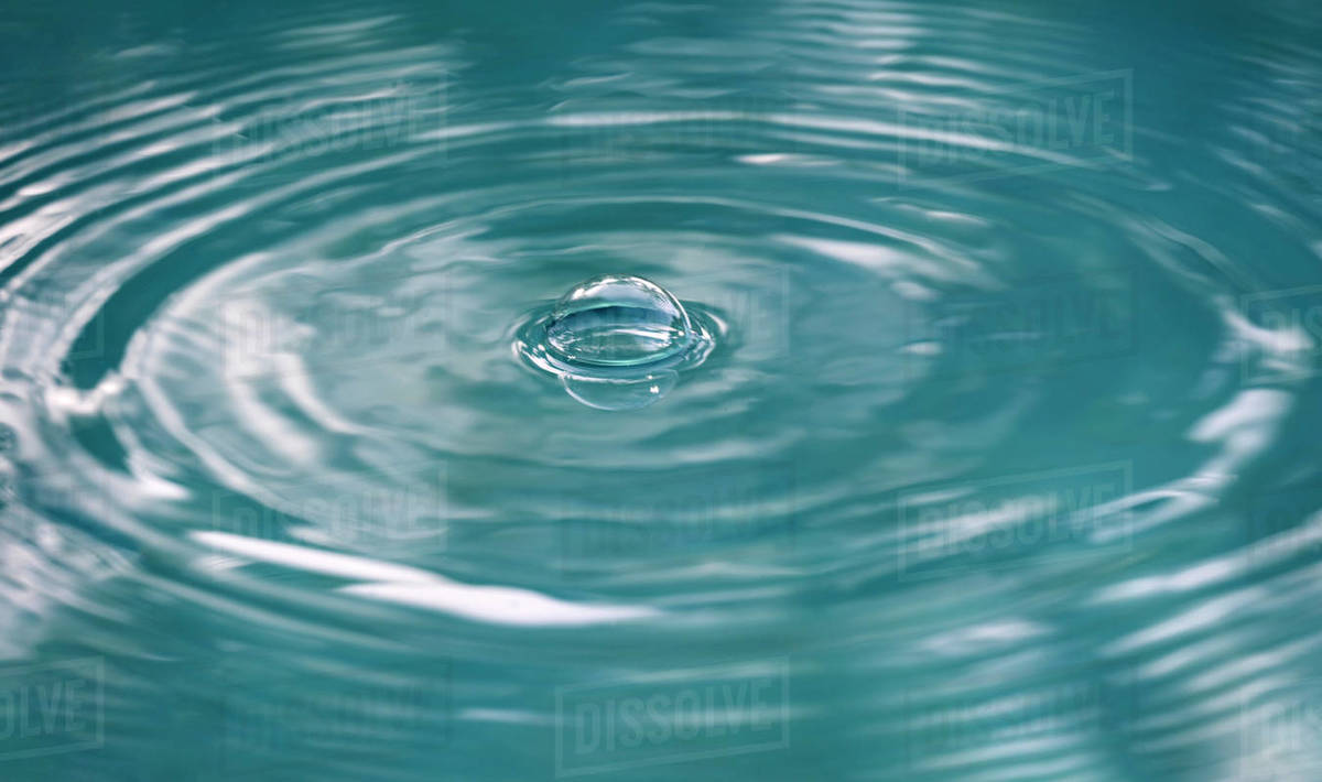 Air bubble on water surface Stock Photo Dissolve