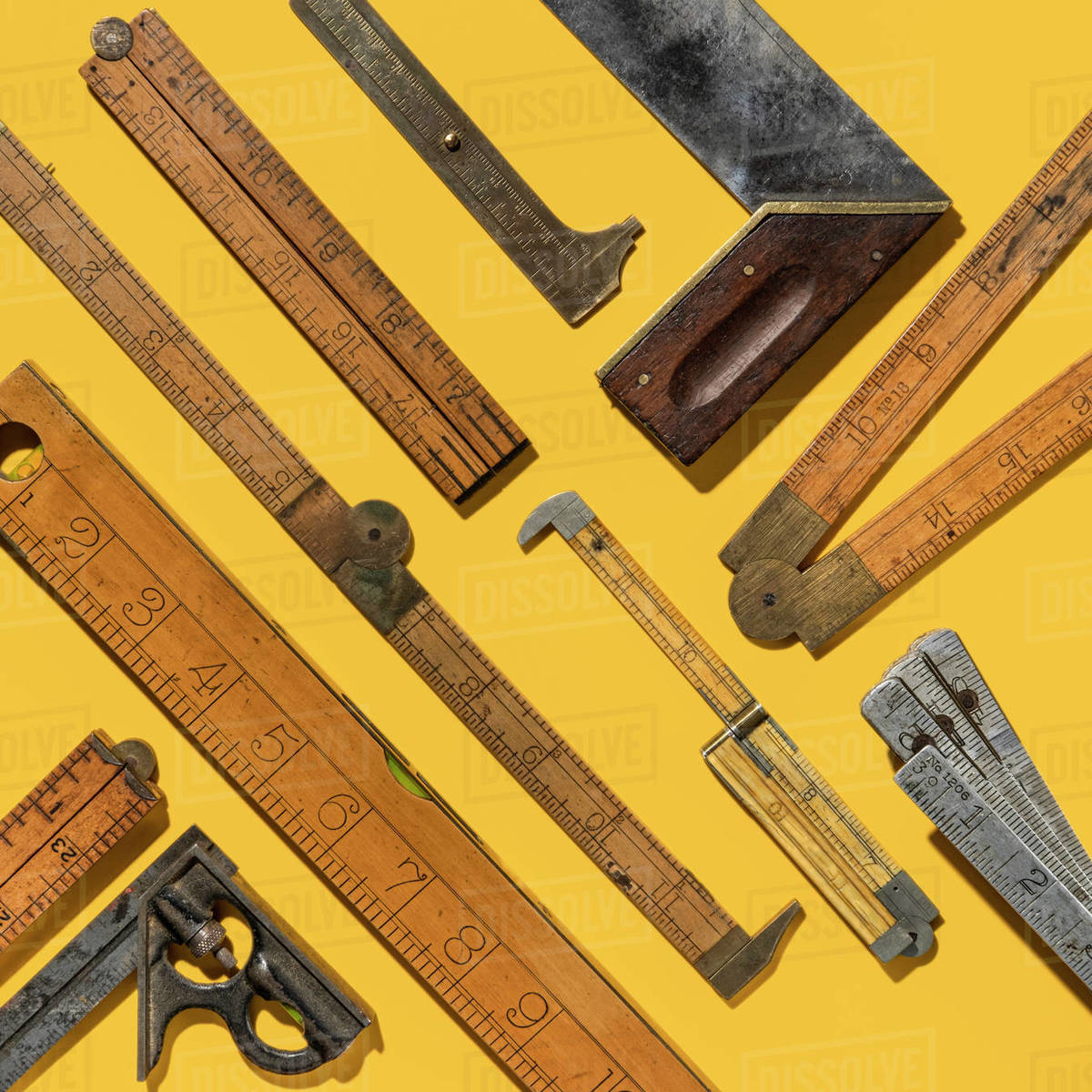 Graphic pattern of vintage rulers on yellow background Stock Photo