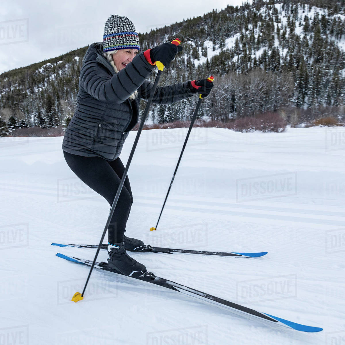 United States, Idaho, sun valley, Senior woman cross country skiing on groomed trails Stock