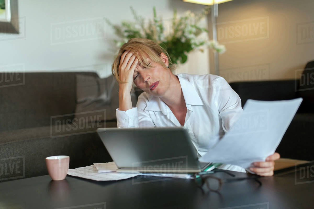 Portrait of overworked woman using computer - Royalty-free Stock Photo ...