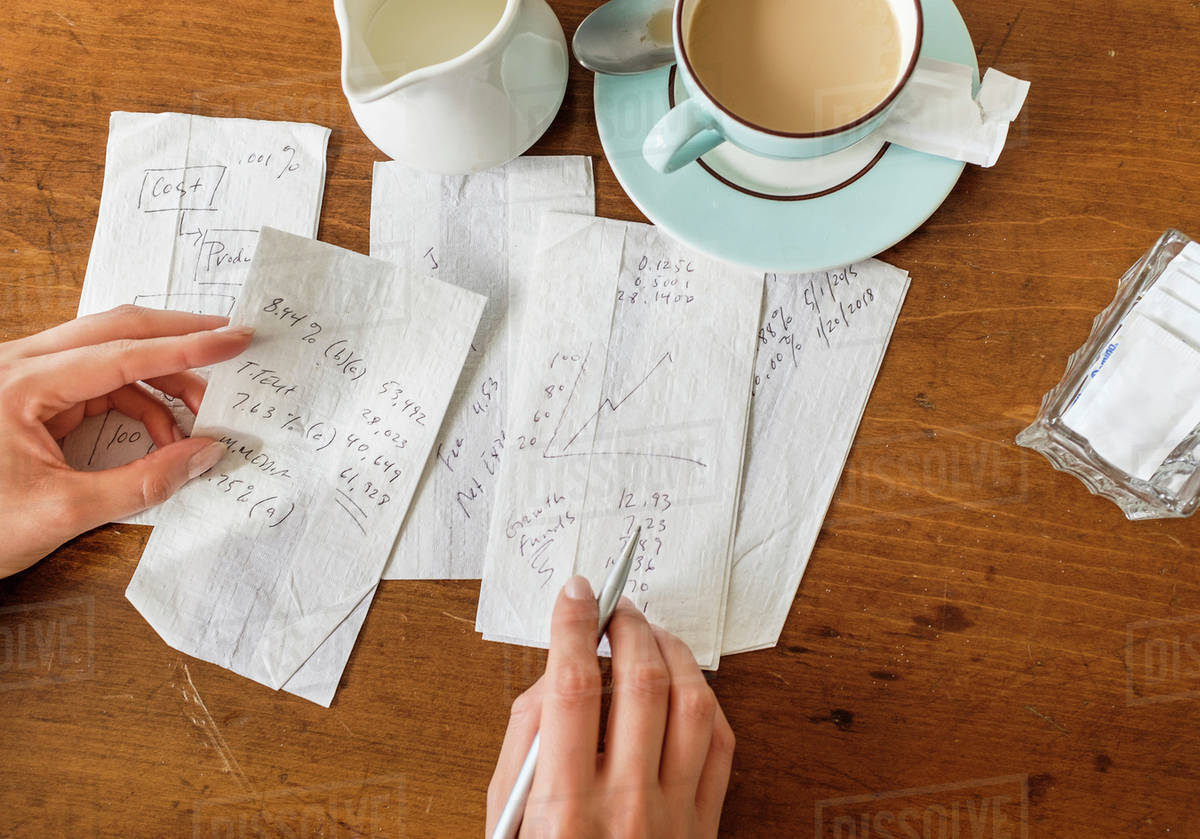 Woman writing on napkins Stock Photo Dissolve