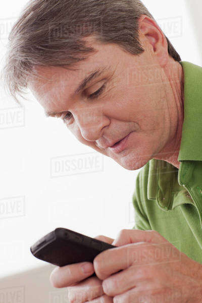 Man using phone - Royalty-free Stock Photo | Dissolve