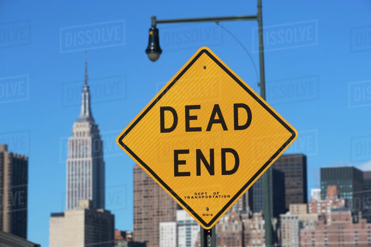 USA, New York City, Cityscape with Dead End road sign - Royalty