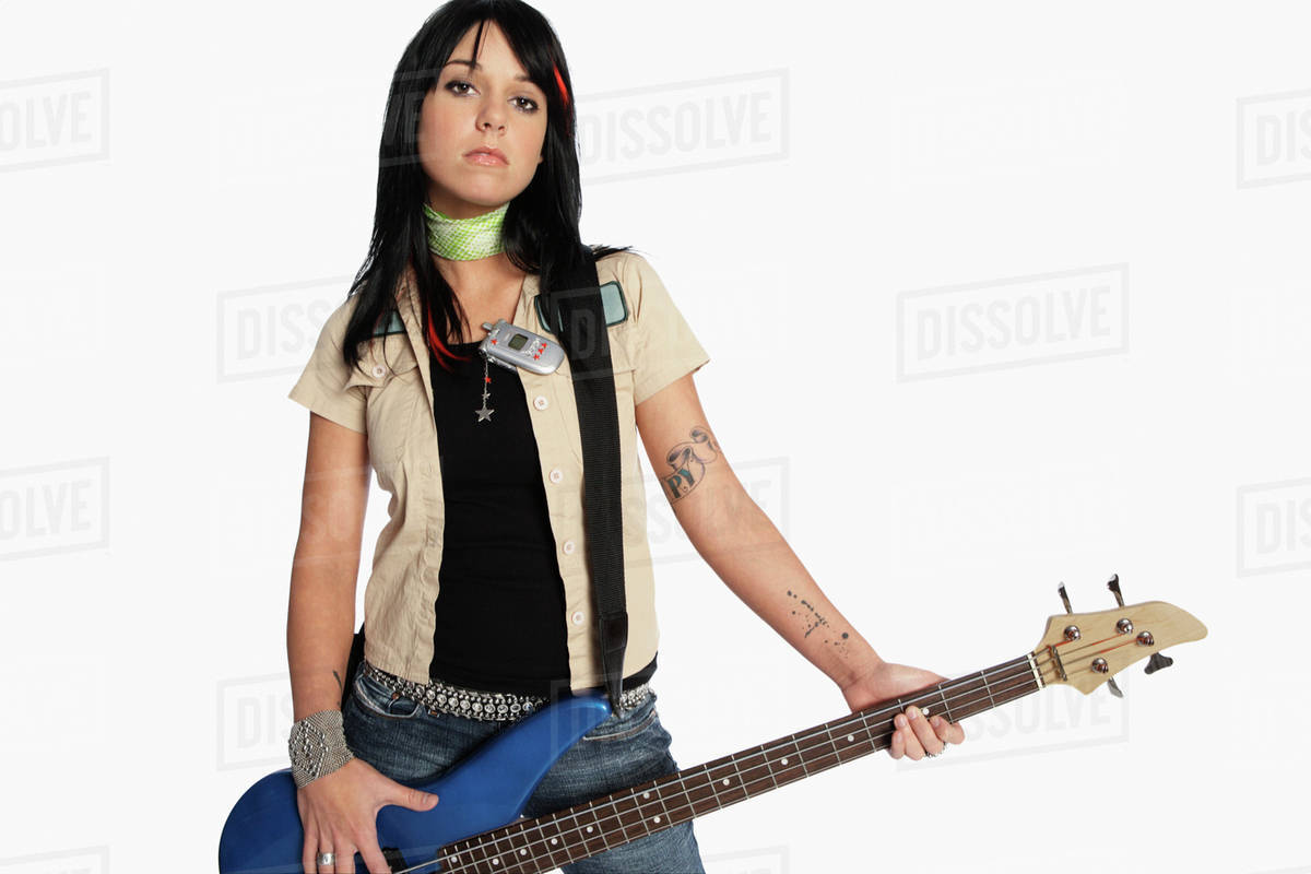 teen girl playing electric guitar Busty in strings