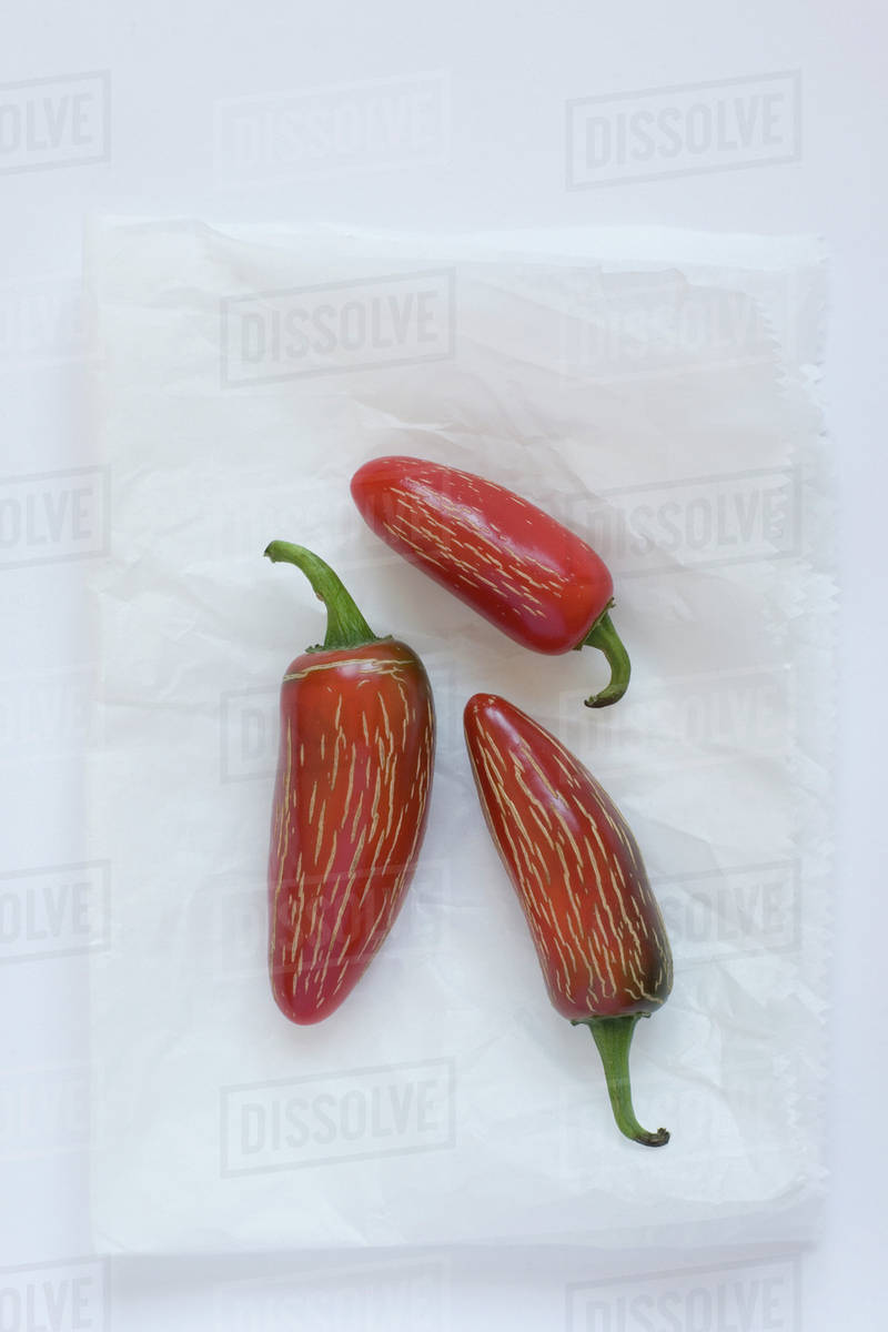 Three spicy fresno peppers Stock Photo Dissolve