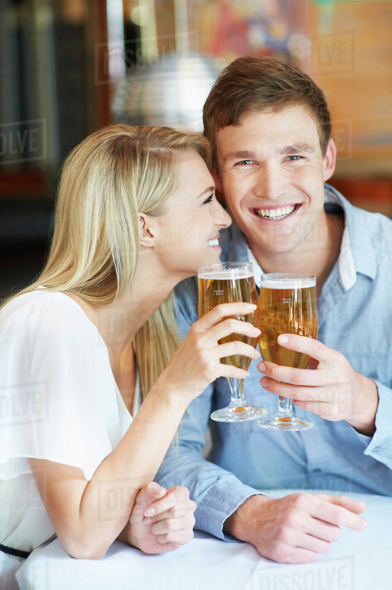 Couple drinking beer Stock Photo Dissolve