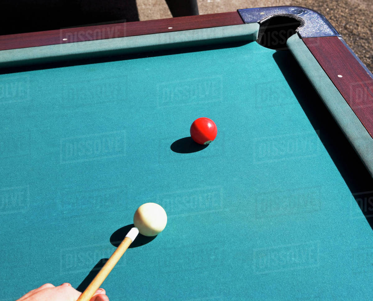 Person shooting pool Stock Photo Dissolve