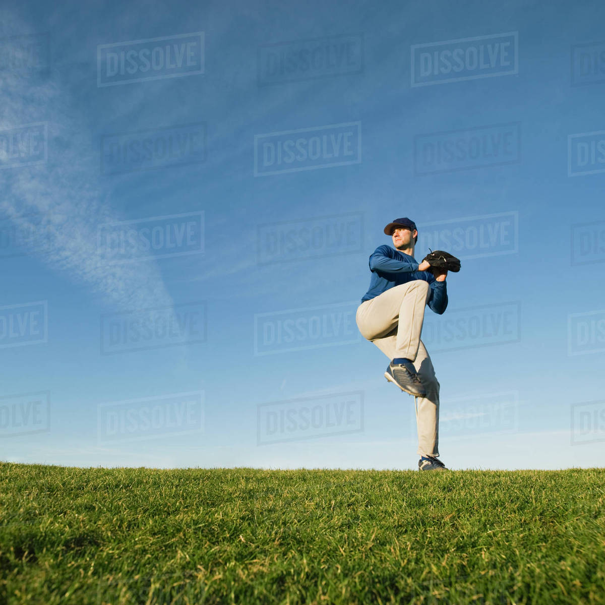 Baseball player throwing ball - Stock Photo - Dissolve