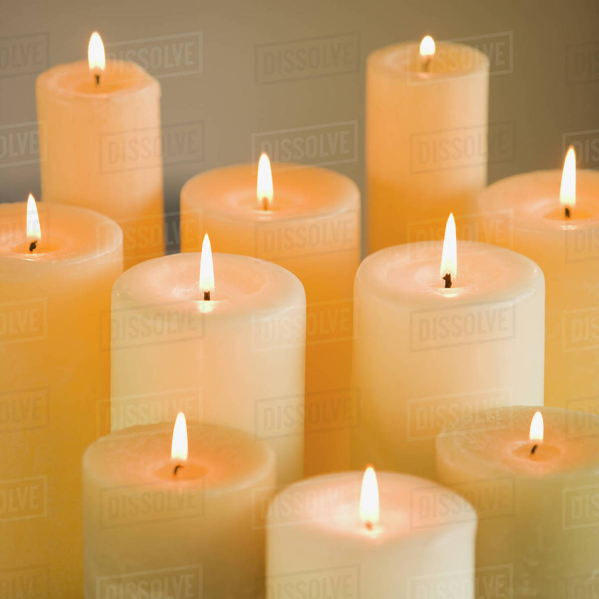Close up of lit candles Stock Photo Dissolve