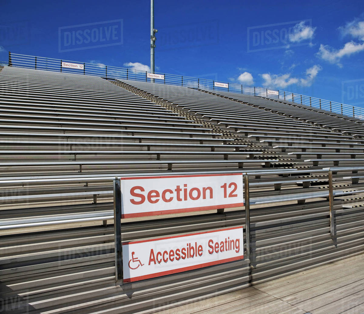 Stadium bleachers with wheelchair accessible seating Stock Photo
