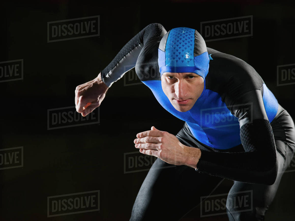 Male speed skater in ready position Stock Photo Dissolve