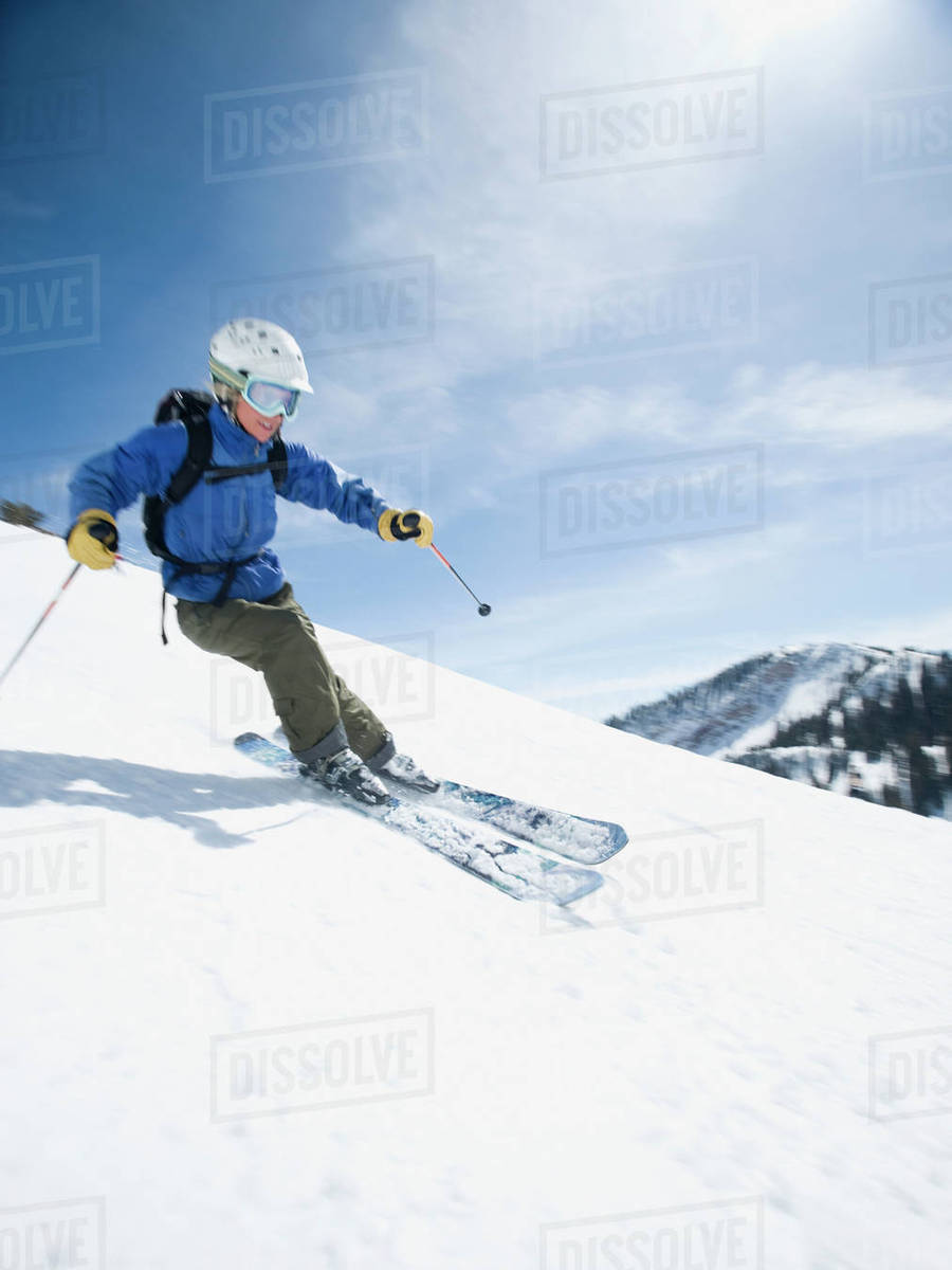 Woman skiing downhill Stock Photo Dissolve