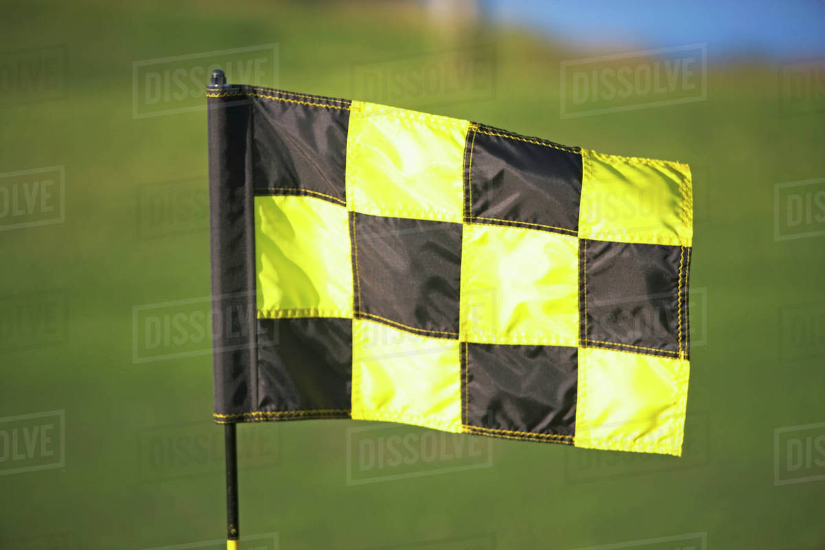 Black and yellow checkered flag Stock Photo Dissolve