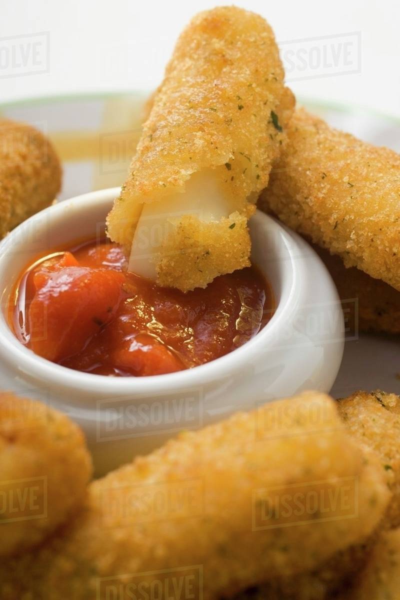 Mozzarella sticks with marinara sauce Stock Photo Dissolve