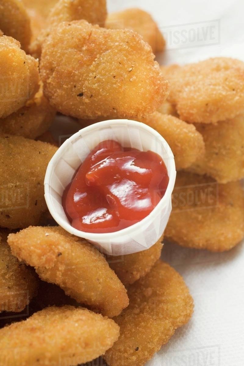 Chicken nuggets with ketchup Stock Photo Dissolve