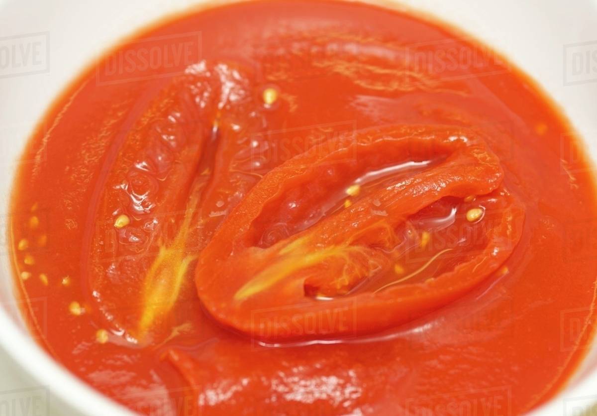 Tinned plum tomatoes - Stock Photo - Dissolve