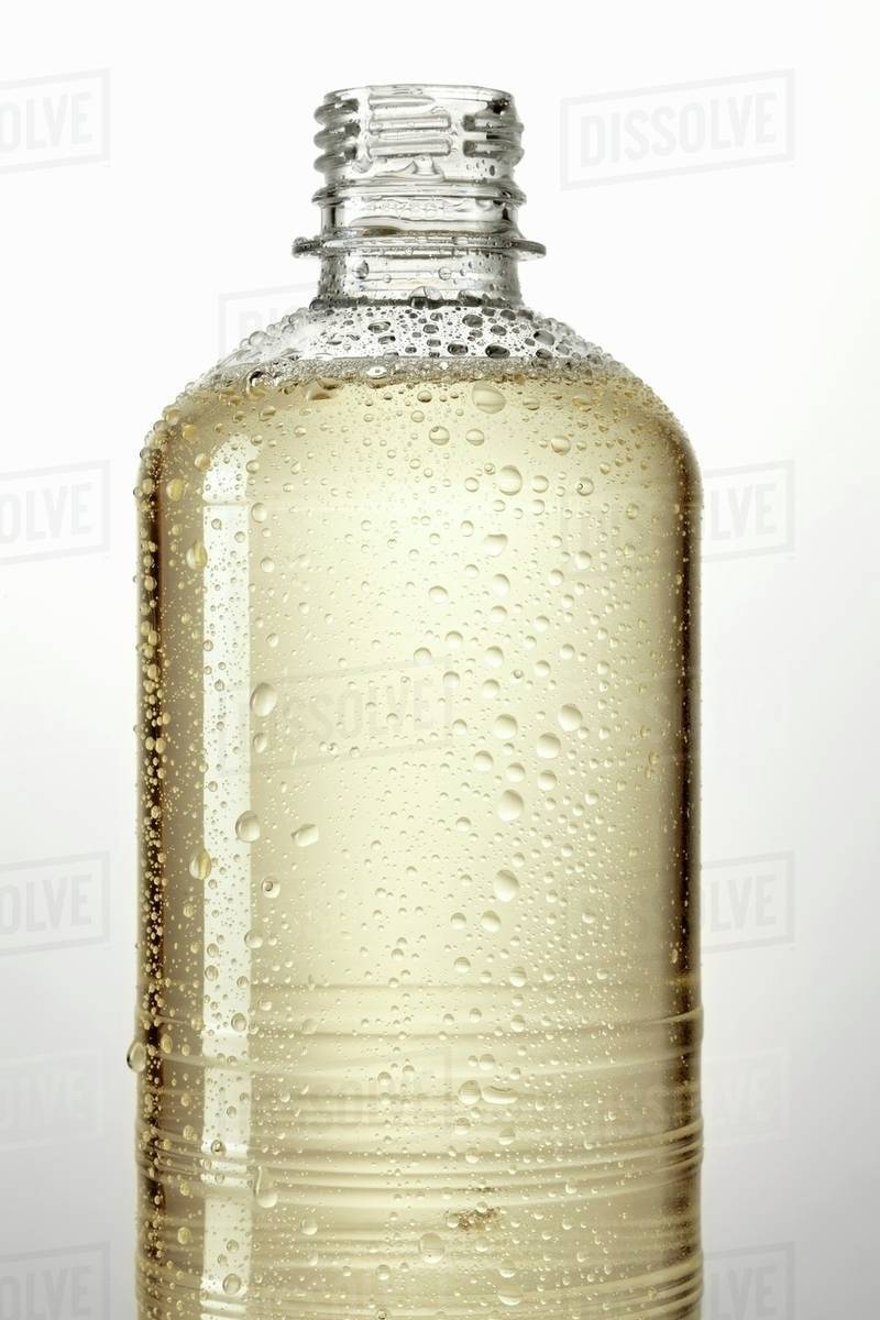 Healthy lemonade in bottle Stock Photo Dissolve