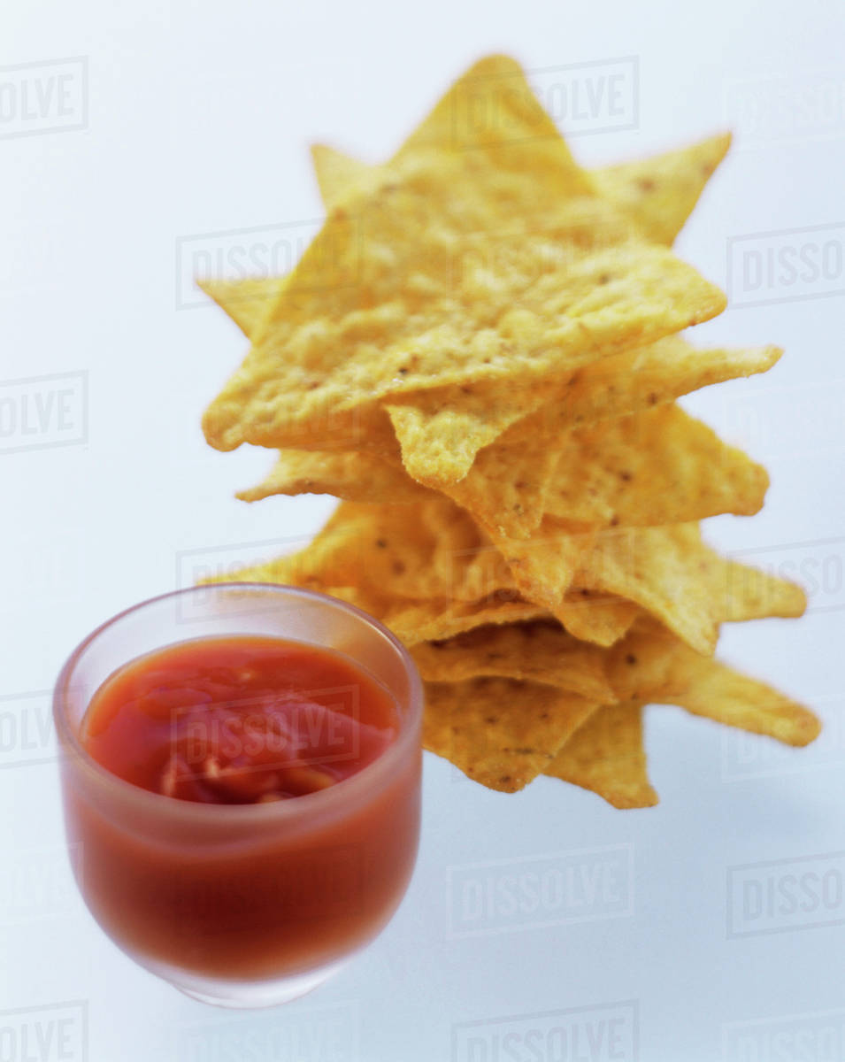 Corn Chips with Salsa Stock Photo Dissolve