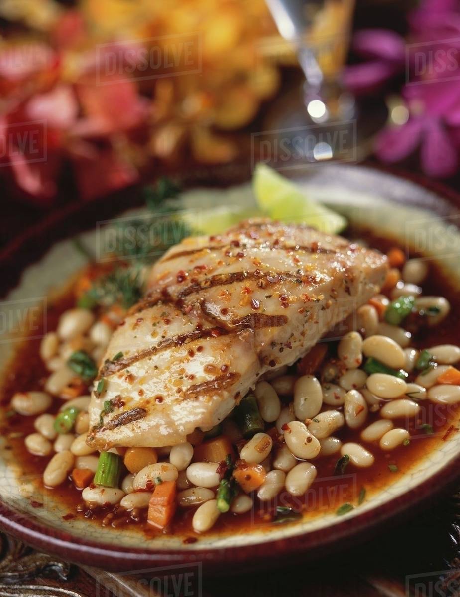 Grilled fish fillet on bean sauce Stock Photo Dissolve