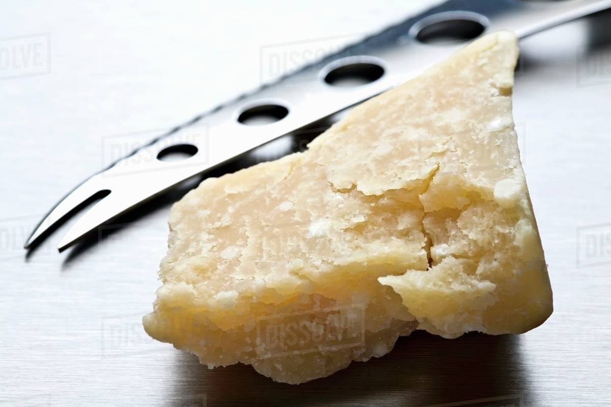 Parmesan and cheese knife Stock Photo Dissolve