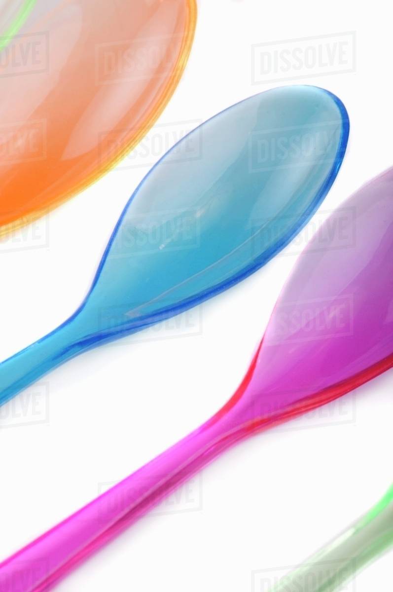 Coloured plastic spoons - Stock Photo - Dissolve