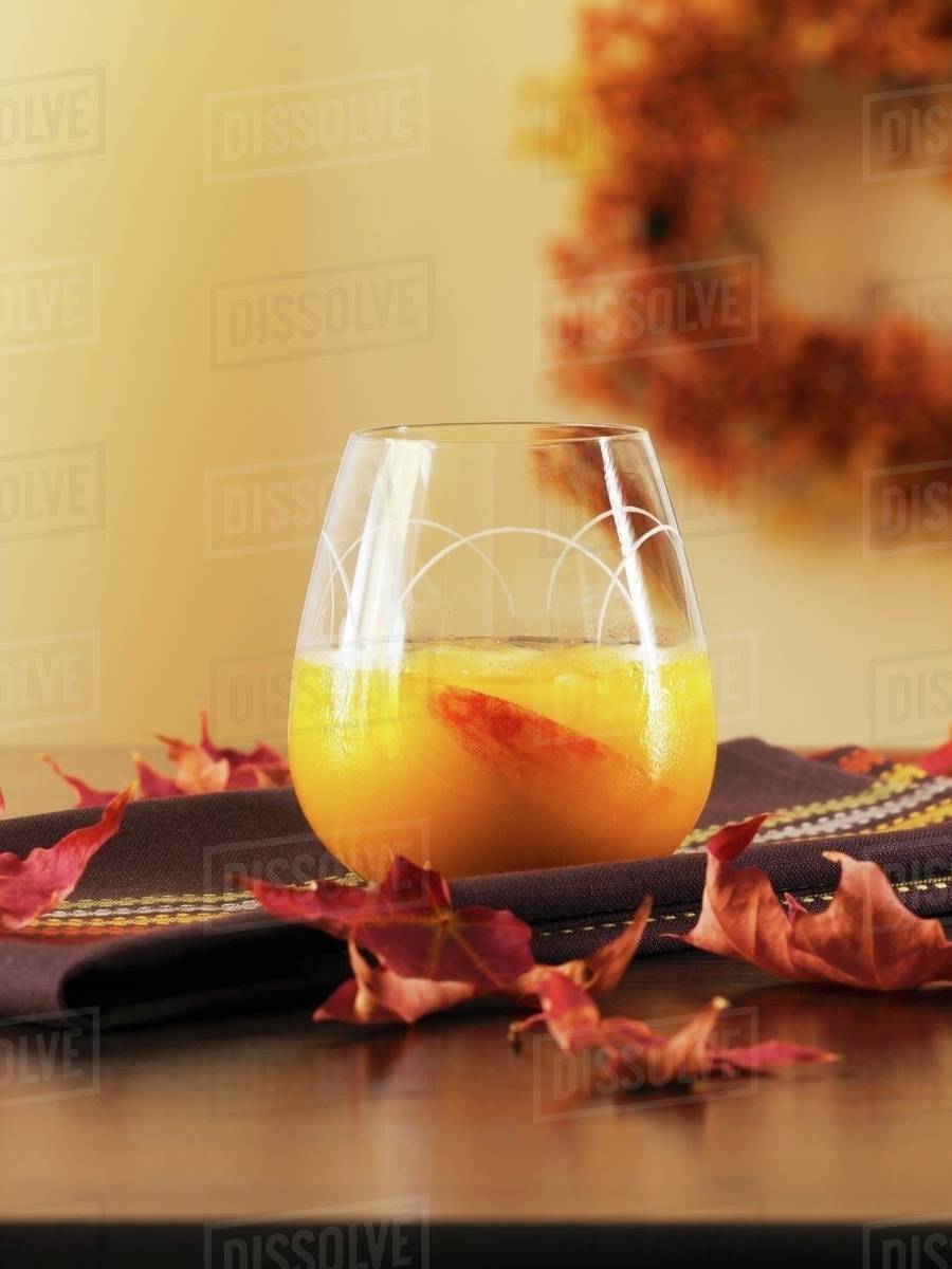Peach drink with nutmeg Stock Photo Dissolve