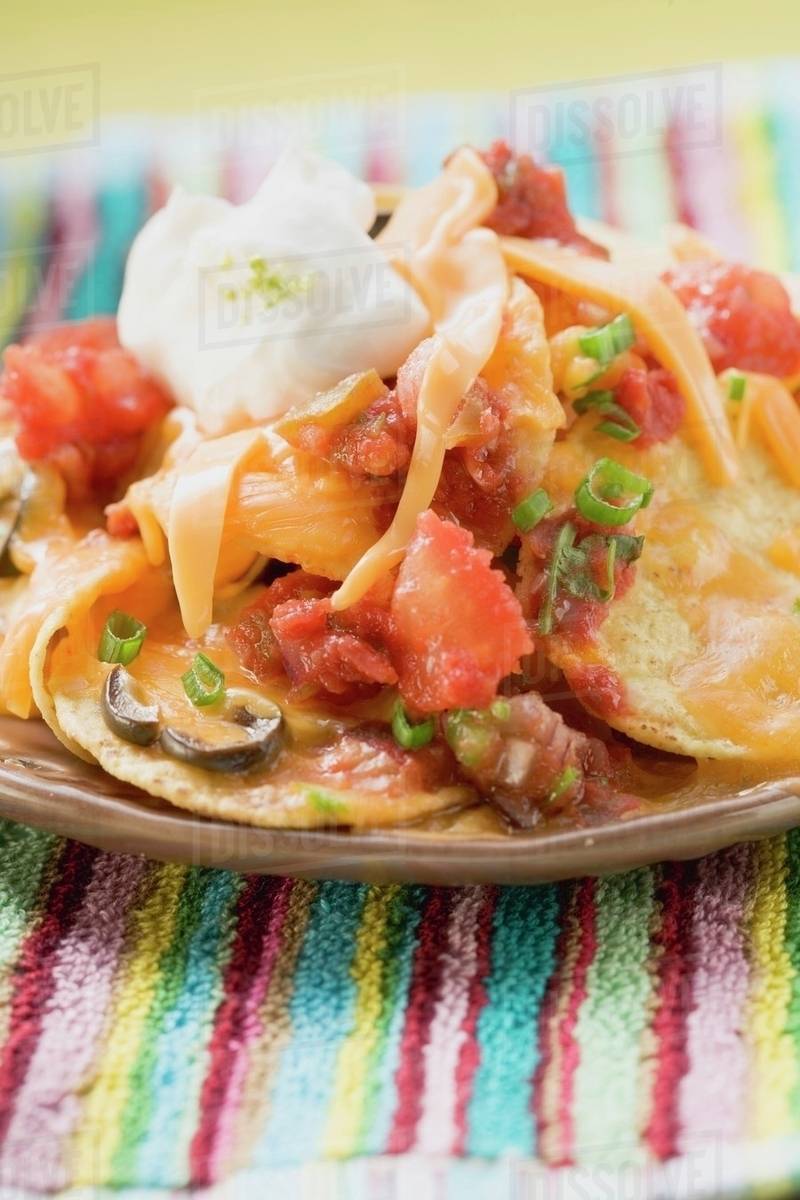 Tortilla chips with melted cheese and sour cream (Mexico) Stock Photo