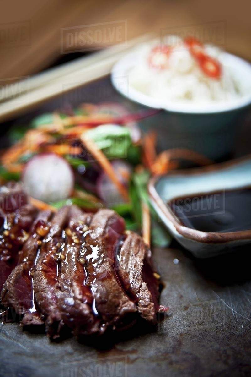 Grilled teriyaki ribeye steak with udon noodles and dashi (Japan