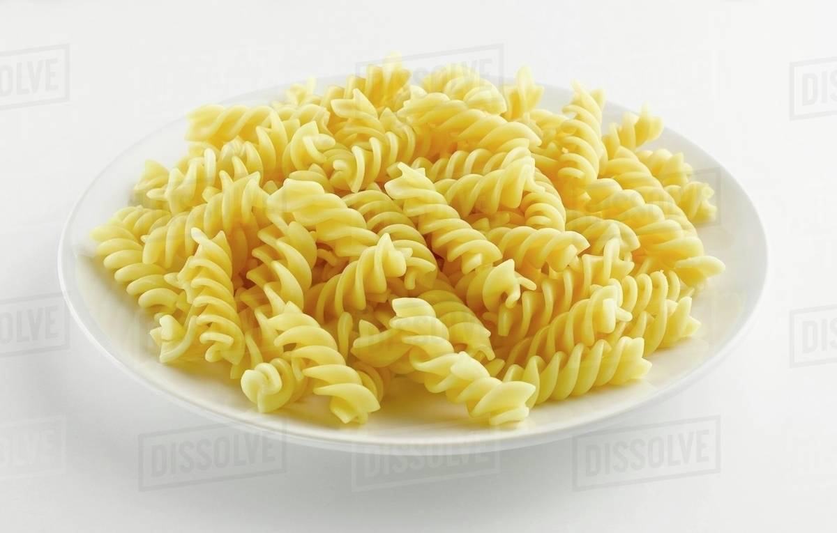 A plate of cooked fusilli Stock Photo Dissolve