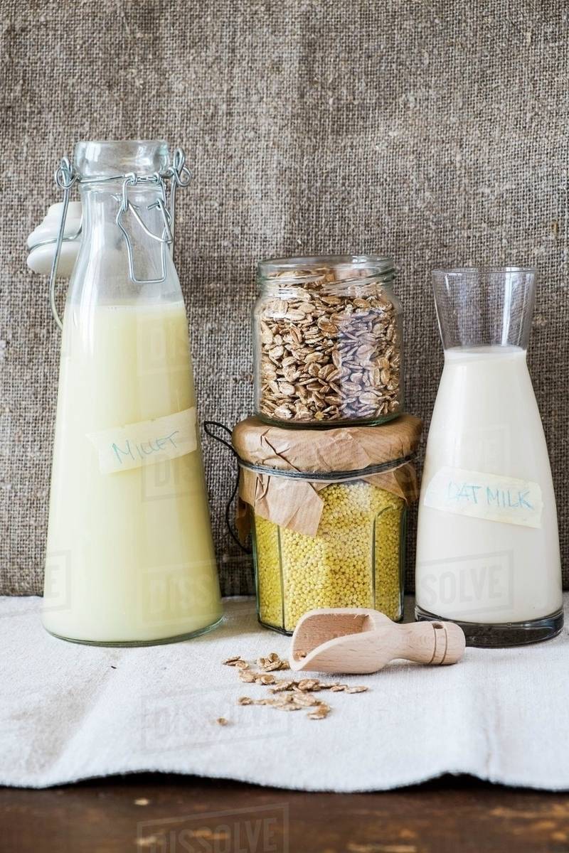 Millet milk, oat milk, millet and oats Stock Photo Dissolve