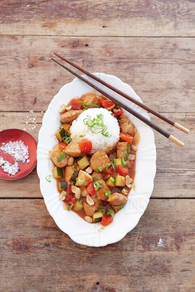 Spicy chicken dish with peanuts, served with rice (Asia) Stock Photo