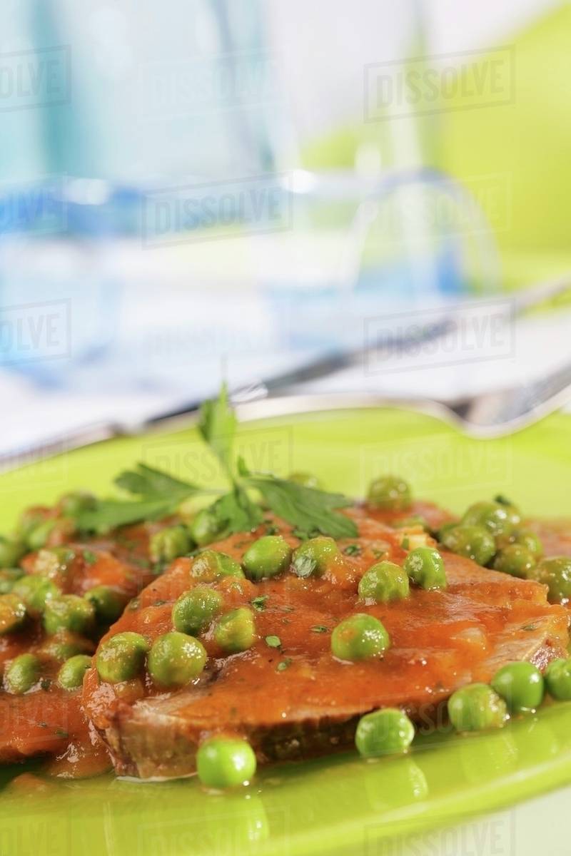 Roast veal with peas Stock Photo Dissolve