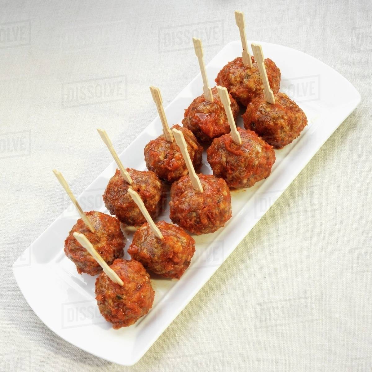 Tapas Meatballs with Wooden Skewers - Stock Photo - Dissolve