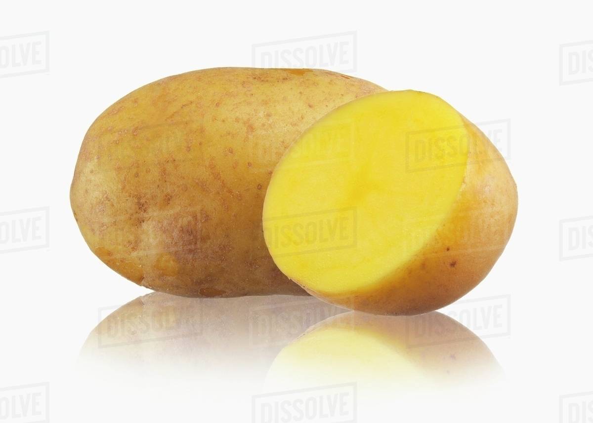 A whole potato and half a potato Stock Photo Dissolve