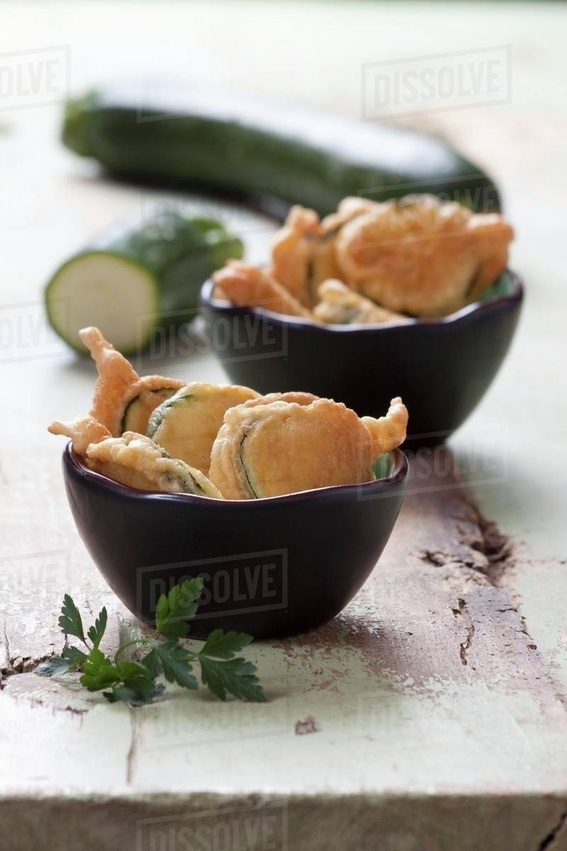 Baked courgette in batter Stock Photo Dissolve