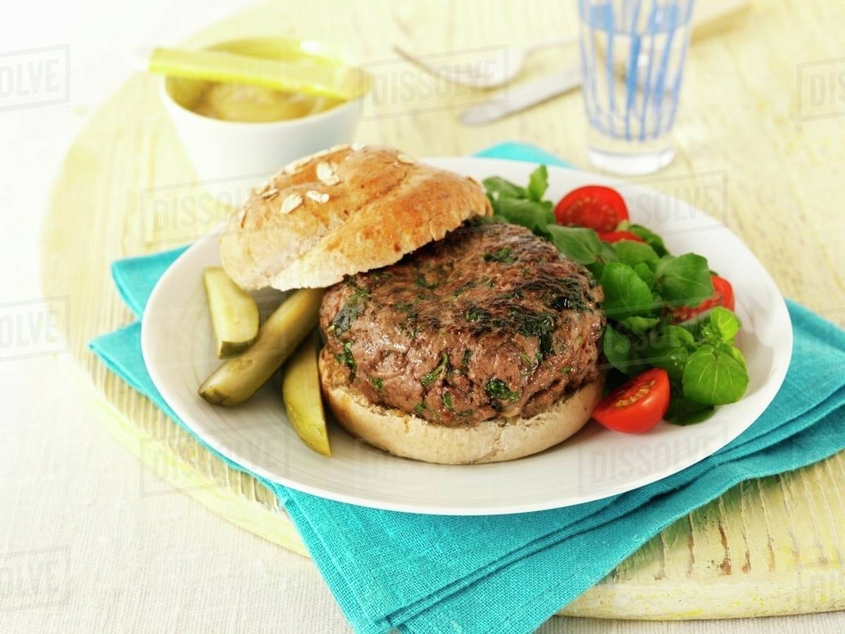 A burger with herbs Stock Photo Dissolve