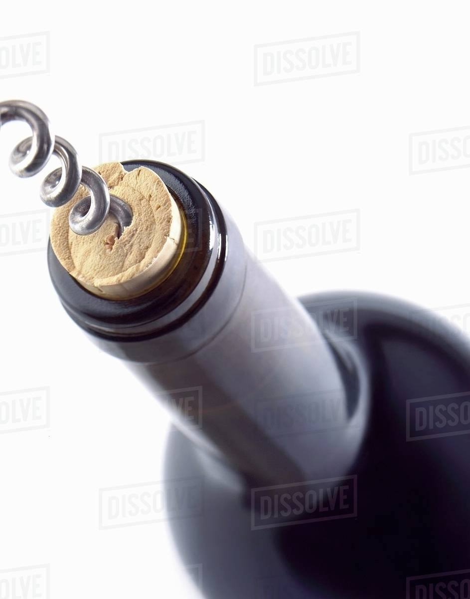 Corkscrew in a Wine Cork in a Bottle Stock Photo Dissolve